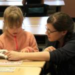Mountain View Elementary School first grade teacher Kristin Perkins helps a student read aloud on Thursday, Oct. 19, 2023, in Kenai, Alaska. (Ashlyn OHaara/Peninsula Clarion)