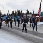 Members of the VFW Post 10221, American Legion Post 16, American Legion Auxiliary, Homer Elks and Emblem Clubs and members of the community march down Pioneer Avenue during the Veterans Day parade on Saturday, Nov. 11, 2023 in Homer, Alaska. (Delcenia Cosman/Homer News)
