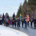 Members of the VFW Post 10221, American Legion Post 16, American Legion Auxiliary, Homer Elks and Emblem Clubs and members of the community march down the Sterling Highway during the Veterans Day parade on Saturday, Nov. 11, 2023 in Homer, Alaska. (Delcenia Cosman/Homer News)