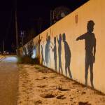 A piece of the longtime Homer mural outside of Nomar points out the newly fallen snow on Friday, Nov. 10, 2023 in Homer, Alaska. (Finn Heimbold/Homer News)