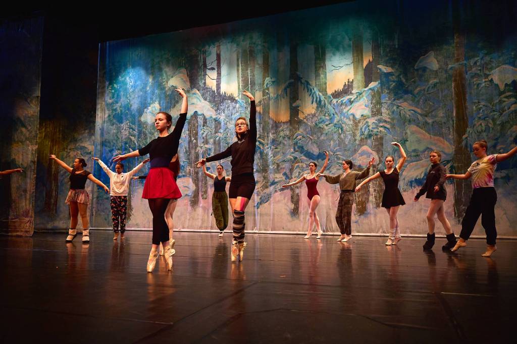 (from left to right) Nutcracker ballet performers Aria Palma, Jaelynn Kennon, Tiya Martushev, Talli Dalke, Ireland Styvar, Sofia Loboy and Ella Gustafson rehearse the Snow dance onstage at the Homer High School Mariner Theatre on Sunday, Nov. 19, 2023 in Homer, Alaska. Photo by Chris Kincaid