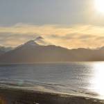 Strong winds blow snow off the mountain peaks across Kachemak Bay on Monday, Nov. 20, 2023 in Homer, Alaska. (Delcenia Cosman/Homer News)
