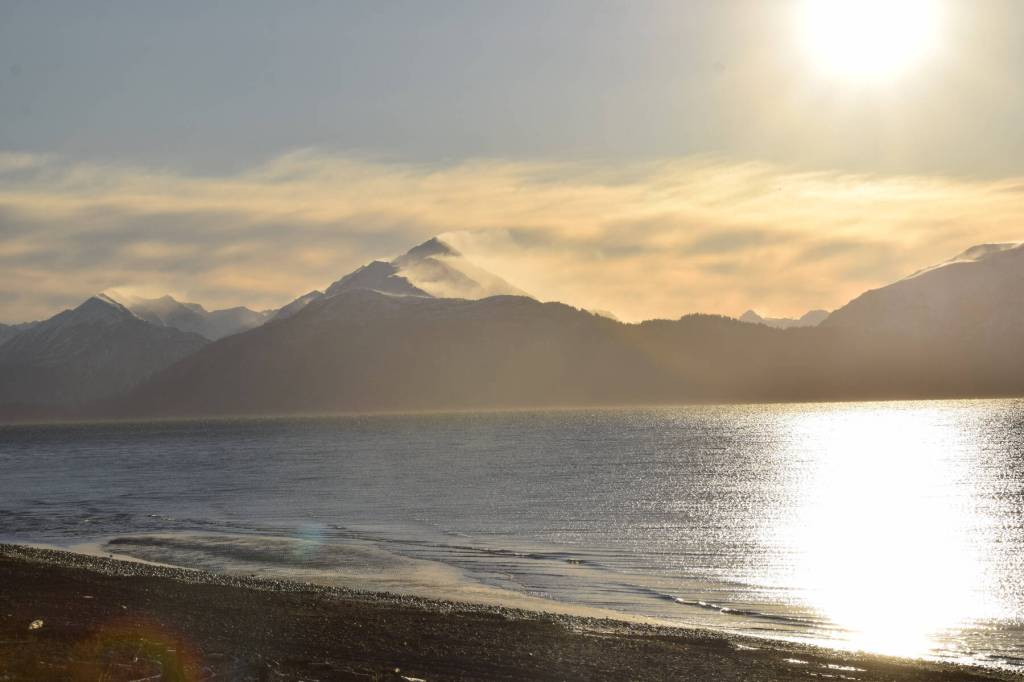 Strong winds blow snow off the mountain peaks across Kachemak Bay on Monday, Nov. 20, 2023 in Homer, Alaska. (Delcenia Cosman/Homer News)