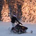 Jake Dye/Peninsula Clarion
A snowmachine rider takes advantage of two feet of fresh snow on a field in Soldotna in December 2022.
