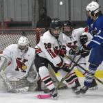 Photo by Jeff Helminiak/Peninsula Clarion
Kenai Centrals Seanna Swanson scrambles to make a save while Cole Langham and Kylee Verkuilen hold off Palmers Elijah Von Gunten on Thursday, Nov. 16, 2023, during Kenai River Cup play at the Kenai Multi-Purpose Facility in Kenai, Alaska.