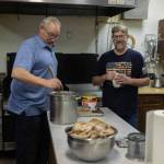 VFW Post 10221 Commander Charles Collins (left) and RNDC District Manager Stacy Lister (right) prepare the community Thanksgiving dinner hosted by the Virl Pa Haga VFW Post 10221 on Thursday, Nov. 23, 2023 in Anchor Point, Alaska. Photo provided by Heidi Adams.