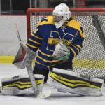 Homers Blaise Banks makes a save against Kenai Central on Thursday, Nov. 30, 2023, at the Kenai Multi-Purpose Facility in Kenai, Alaska. (Photo by Jeff Helminiak/Peninsula Clarion)
