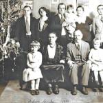 Peter and Pearl Bodnar (front, center) pose for a 1930 Christmas portrait with much of their family, probably in Manitoba, Canada. Pictured are: (back row, L-R) Alex, sister Anna (Bodnar) Bandura, brother Michael holding daughter Pearl next to his wife Jessie, and Marcus. In the front row are: Michaels eldest daughter Olga, parents Parascevies Pearl and Peter Bodnar, and Michaels middle daughter Marion. (Photo courtesy of the Bodnar Family Collection)