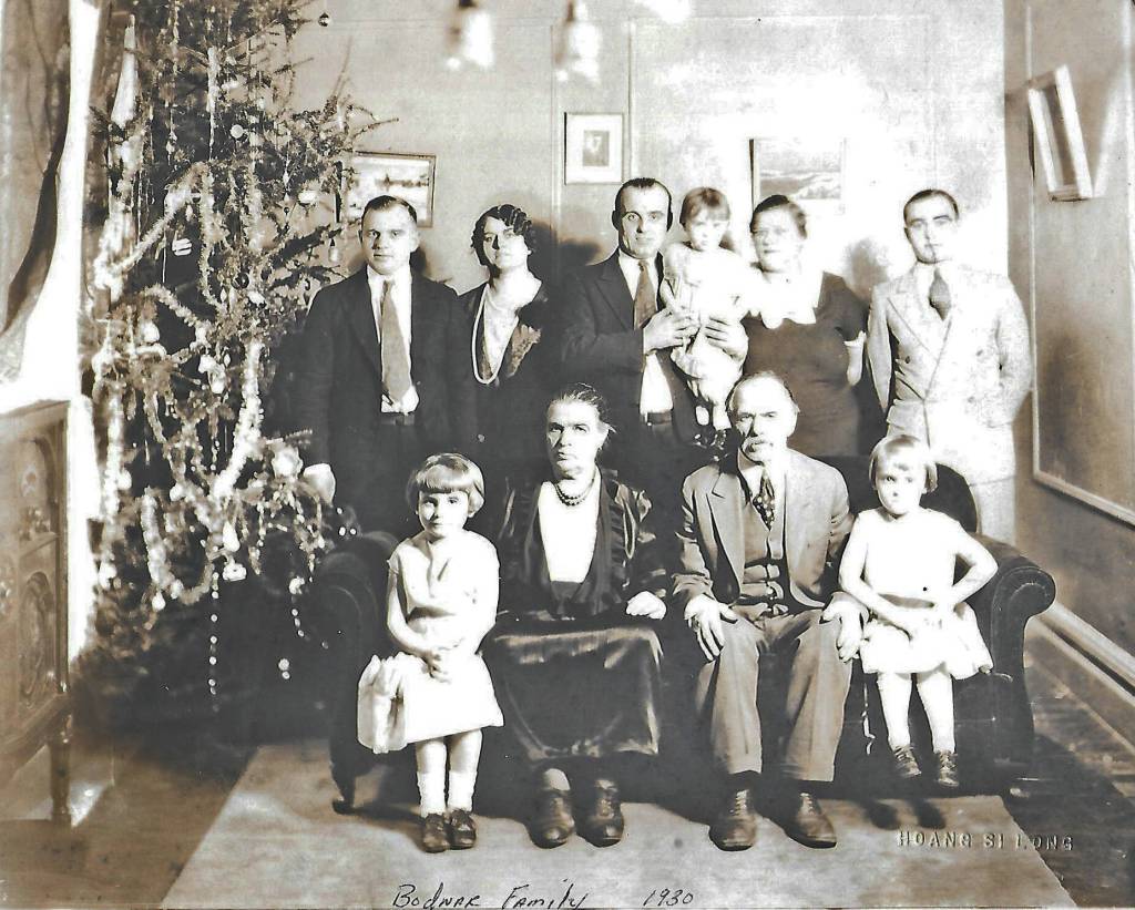Peter and Pearl Bodnar (front, center) pose for a 1930 Christmas portrait with much of their family, probably in Manitoba, Canada. Pictured are: (back row, L-R) Alex, sister Anna (Bodnar) Bandura, brother Michael holding daughter Pearl next to his wife Jessie, and Marcus. In the front row are: Michaels eldest daughter Olga, parents Parascevies Pearl and Peter Bodnar, and Michaels middle daughter Marion. (Photo courtesy of the Bodnar Family Collection)