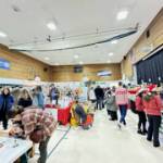 Community members shop the Procrastinators Fair at West Homer Elementary on Saturday, Dec. 9, 2023 in Homer, Alaska. Photo courtesy of Callie Steinberg