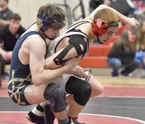 Homers Brayden Woods wrestles Nikiskis Frank St. Denis in the championship at 152 pounds at the Kachemak Conference wrestling tournament at Kenai Central High School in Kenai, Alaska, on Saturday, Dec. 9, 2023. Woods won by pin. (Photo by Jeff Helminiak/Peninsula Clarion)