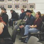 Ashlyn OHara/Peninsula Clarion
Audience members listen to Iris Fontana, of the Satanic Temple, deliver an invocation during a Kenai Peninsula Borough Assembly meeting on Tuesday, Dec. 12, in Soldotna. Fontana was the last person to deliver an assembly invocation before a new borough policy, which says only borough volunteer chaplains may deliver the invocation, takes effect.