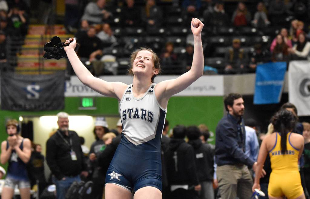 Soldotnas Kaytlin McAnelly celebrates winning the girls title at 132 pounds Saturday, Dec. 16, 2023, at the state wrestling tournament at the Alaska Airlines Center in Anchorage, Alaska. (Photo by Jeff Helminiak/Peninsula Clarion)