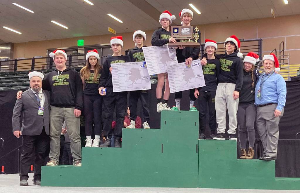 Seward celebrates winning the Division II state wrestling title Saturday, Dec. 16, 2023, at the state wrestling tournament at the Alaska Airlines Center in Anchorage, Alaska. (Photo by Jeff Helminiak/Peninsula Clarion)