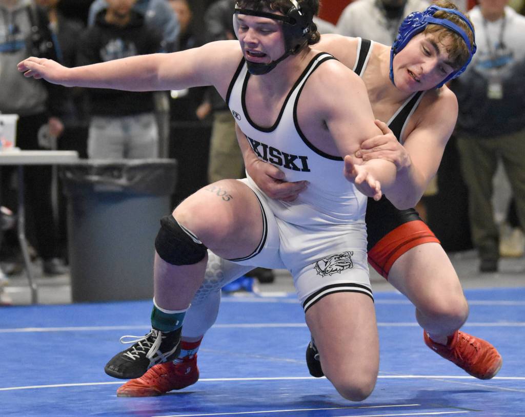 Sitkas Aiden Ojala works his way to a pin of Nikiskis Truit McCaughey in the Division II final at 215 pounds Saturday, Dec. 16, 2023, at the state wrestling tournament at the Alaska Airlines Center in Anchorage, Alaska. (Photo by Jeff Helminiak/Peninsula Clarion)