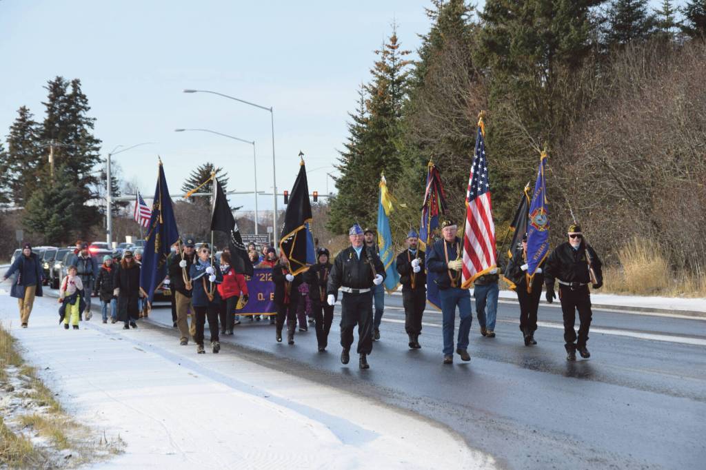 Members of the VFW Post 10221, American Legion Post 16, American Legion Auxiliary, Homer Elks and Emblem Clubs and members of the community march down the Sterling Highway during the Veterans Day parade on Saturday, Nov. 11<ins>,</ins><ins> 2023 in Homer, </ins><ins>Alaska</ins>. (Delcenia Cosman/Homer News)