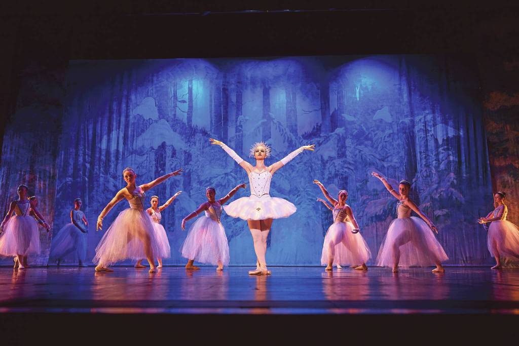 Snow Queen Tiya Martushev and corps dancers strikes the final pose in the Snow dance onstage at the Mariner Theatre during the final Nutcracker dress rehearsal at Homer High School on Thursday, Nov. 30<ins>,</ins> <ins>2023</ins>. Photo by Christopher Kincaid