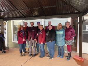 Emilie Springer/Homer News
Members of Homers Elks Lodge and employees of Hospice of Homer stand under the new gazebo donated by the lodge at the end of 2023.