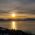 The late morning sun rises over the mountains across Kachemak Bay on Tuesday, Jan. 16, 2024 in Homer, Alaska. (Delcenia Cosman/Homer News)
