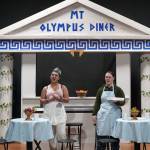 Kassándra Feltman portrays Pandora and Heather Prisk portrays Cassandra during a rehearsal of Greece is the Word: The Zeusical at the Kenai Performers Theatre in Soldotna, Alaska, on Saturday, Jan. 6, 2024. (Jake Dye/Peninsula Clarion)