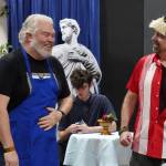 David Brighton portrays Zeus and Todd Sherwood portrays Sparky Guy during a rehearsal of Greece is the Word: The Zeusical at the Kenai Performers Theatre in Soldotna, Alaska, on Saturday, Jan. 6, 2024. (Jake Dye/Peninsula Clarion)