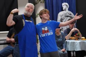 David Brighton portrays Zeus and Gage Sturman portrays Narcissus during a rehearsal of Greece is the Word: The Zeusical at the Kenai Performers Theatre in Soldotna, Alaska, on Saturday, Jan. 6, 2024. (Jake Dye/Peninsula Clarion)