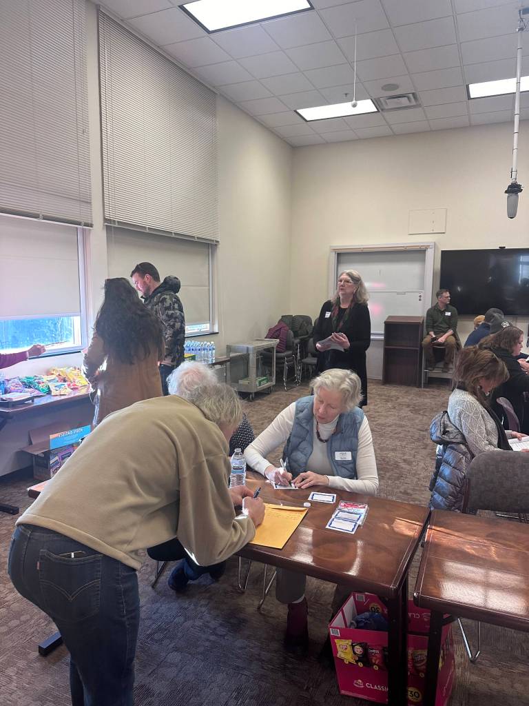 Attendees register for the short-term rentals panel organized by the Homer Chamber of Commerce on Wednesday, Jan. 17, 2024 at Kachemak Bay Campus in Homer, Alaska. Photo provided by Mina Gherman