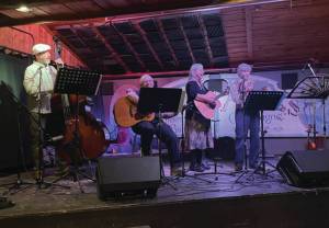 Photo by Emilie Springer/Homer News
Banned musicians Scott Bartlett, Martie Krohn, Cindy McKenna and Cathy Stingley provide music at the opening night for the Big Read at Alices Champagne Palace on Friday.