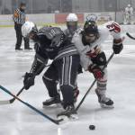 Photo by Jeff Helminiak/Peninsula Clarion
Soldotnas Marshall Deraeve and Kenai Centrals Will Howard battle for the puck Friday at the Kenai Multi-Purpose Facility.