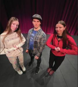 Photo provided by Homer High School Yearbook staff
Homer High School Poetry Out Loud competition winners Bea McDonough, Clark Milstead and Bryce Glidden on the Mariner High School Stage on Jan. 24.