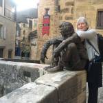 Artist Deb Lowney poses with a statue in France in 2017. Photo provided by Deb Lowney