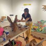 Homer artist Carla Cope crafts a mask at Bunnells Makers Space session on Jan. 28 for parade art construction. (Emilie Springer/Homer News)