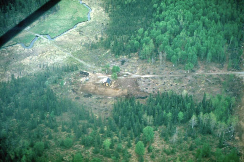Virgil Dahler photo courtesy of the KPC historical photo archive
This aerial view from about 1950 shows Jack Keelers home on his homestead east of Soldotna. The stream to the left is Soldotna Creek, and the bridge across the stream probably allowed early access to the Mackey Lakes area. The road to the right edge of the photo leads to the Sterling Highway.
