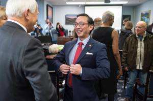 Sen. Scott Kawasaki, D-Fairbanks, gathers with other senators and families as they prepare for the opening of the Alaskas 31st Legislative Session on Tuesday, Jan. 15, 2019. (Michael Penn | Juneau Empire)