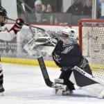 Houstons Brody Richard gets a puck past Soldotna goalie Tanner Clyde at the Division II state hockey tournament Saturday, Feb. 3, 2024, at the Soldotna Regional Sports Complex in Soldotna, Alaska. (Photo by Jeff Helminiak/Peninsula Clarion)