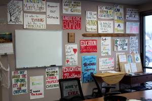 Signs hang on the entryway wall at the Kenai Peninsula Education Association office in Soldotna, Alaska, in this Thursday, Oct. 28, 2021, file photo. (Ashlyn OHara/Peninsula Clarion)