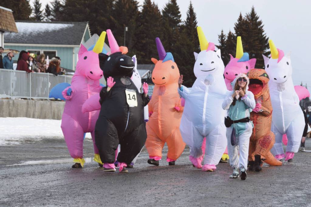 The Unicorn Bunch dances down Pioneer Avenue to The Hokey Pokey the 70th annual Homer Winter Carnival Parade on Saturday, Feb. 10, 2024 in Homer, Alaska. (Delcenia Cosman/Homer News)