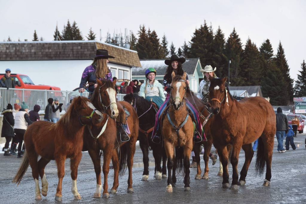 The Alaska Stars Drill Team rides down Pioneer Avenue at the 70th annual Homer Winter Carnival Parade on Saturday, Feb. 10, 2024 in Homer, Alaska. (Delcenia Cosman/Homer News)
