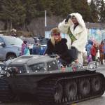 Duncan Hughes, the 2024 Mr. Homer, drives with his wife, Faith Hughes, down Pioneer Avenue at the 70th annual Homer Winter Carnival Parade on Saturday, Feb. 10, 2024 in Homer, Alaska. (Delcenia Cosman/Homer News)