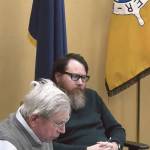 Homer city planner Ryan Foster (rear) listens as commissioner Franco Venuti (front) explains his reasons for voting against Doyon, Limiteds conditional use permit application at the Planning Commission special meeting on Wednesday, Jan. 31<ins>, 2024</ins> in the Homer City Hall Cowles Council Chambers<ins> in Homer, Alaska</ins>. Screenshot.