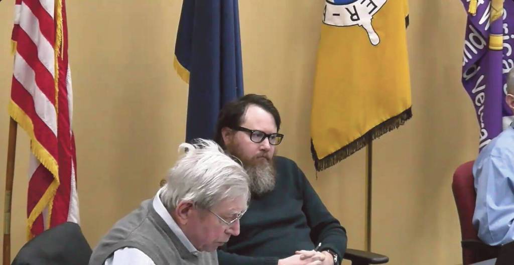 Homer city planner Ryan Foster (rear) listens as commissioner Franco Venuti (front) explains his reasons for voting against Doyon, Limiteds conditional use permit application at the Planning Commission special meeting on Wednesday, Jan. 31<ins>, 2024</ins> in the Homer City Hall Cowles Council Chambers<ins> in Homer, Alaska</ins>. Screenshot.