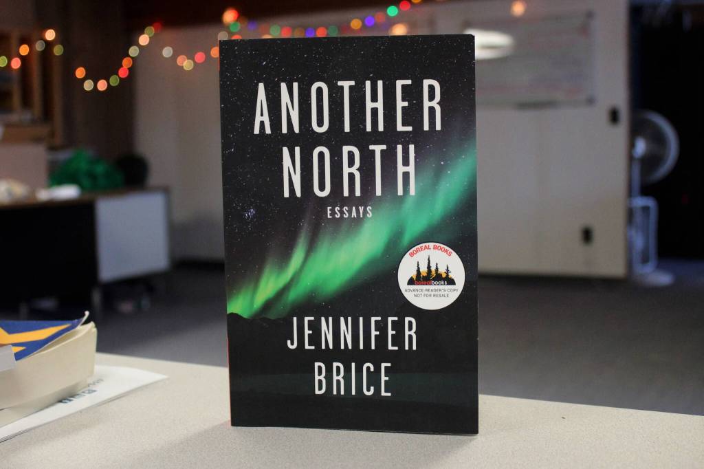 A copy of Jennifer Brices Another North: Essays rests on a desk inside the Peninsula Clarion offices on Thursday, Feb. 8, 2024 in Kenai, AK. (Ashlyn OHara/Peninsula Clarion)