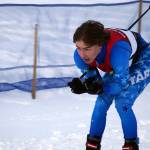 Parker Richards tucks as he moves into the finish chute during the Region III Boys 7.5K Classic Race at Tsalteshi Trails near Soldotna, Alaska, on Saturday, Feb. 10, 2024. (Jake Dye/Peninsula Clarion)