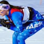Soldotnas Ariana Cannava tucks as she races through the finish chute during the Region III Girls 7.5K Classic Race at Tsalteshi Trails near Soldotna, Alaska, on Saturday, Feb. 10, 2024. (Jake Dye/Peninsula Clarion)