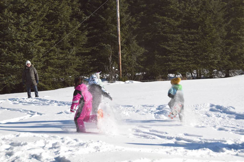 Anchor Point youth run towards the finish line during the Snow Rondi kids snowshoe races on Saturday<ins>, March 2, 2024</ins> at Fireweed Meadows golf course<ins> in Anchor Point, Alaska</ins>. (Delcenia Cosman/Homer News)