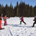 Anchor Point youth run a relay during the Snow Rondi kids snowshoe races on Saturday, March 2<ins>, 2024</ins> at Fireweed Meadows golf course<ins> in Anchor Point, Alaska</ins>. (Delcenia Cosman/Homer News)