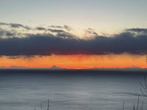 Callie Steinberg/Homer News
Mt. Augustine is visible in the distance looking out across Kachemak Bay as the sun sets on Wednesday, Feb. 28.