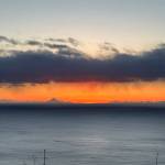 Mt. Augustine is visible in the distance looking out across Kachemak Bay as the sun sets on Wednesday, Feb. 28, 2024 in Homer, Alaska. (Callie Steinberg/Homer News)