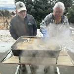 Photo provided by Karyn Murphy
Patty Lekanoff-Gregory and her husband Dave bathe the hats in hot water to make the wood pliable outside of the lab at Islands and Oceans.