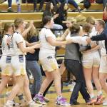 Photo by Jeff Helminiak/Peninsula Clarion
The Homer girls celebrate second place and a Class 3A state berth Saturday at the Peninsula Conference tournament at Homer High School. The Homer girls and Seward boys basketball teams secured berths at this months tournament in Anchorage. For more, see Sports, B4.